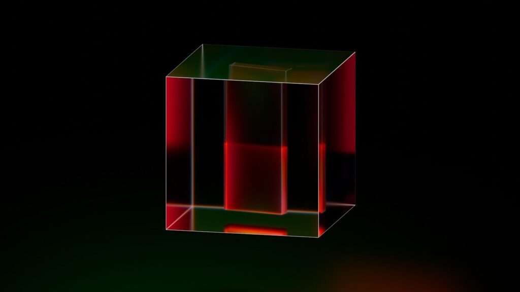 A red and green cube on a black background