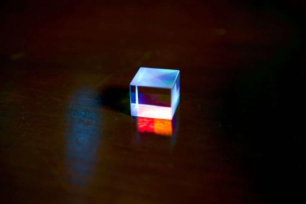 a small white cube sitting on top of a wooden table